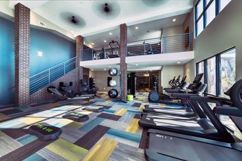 Two-level fitness center w/ state-of-the-art equipment